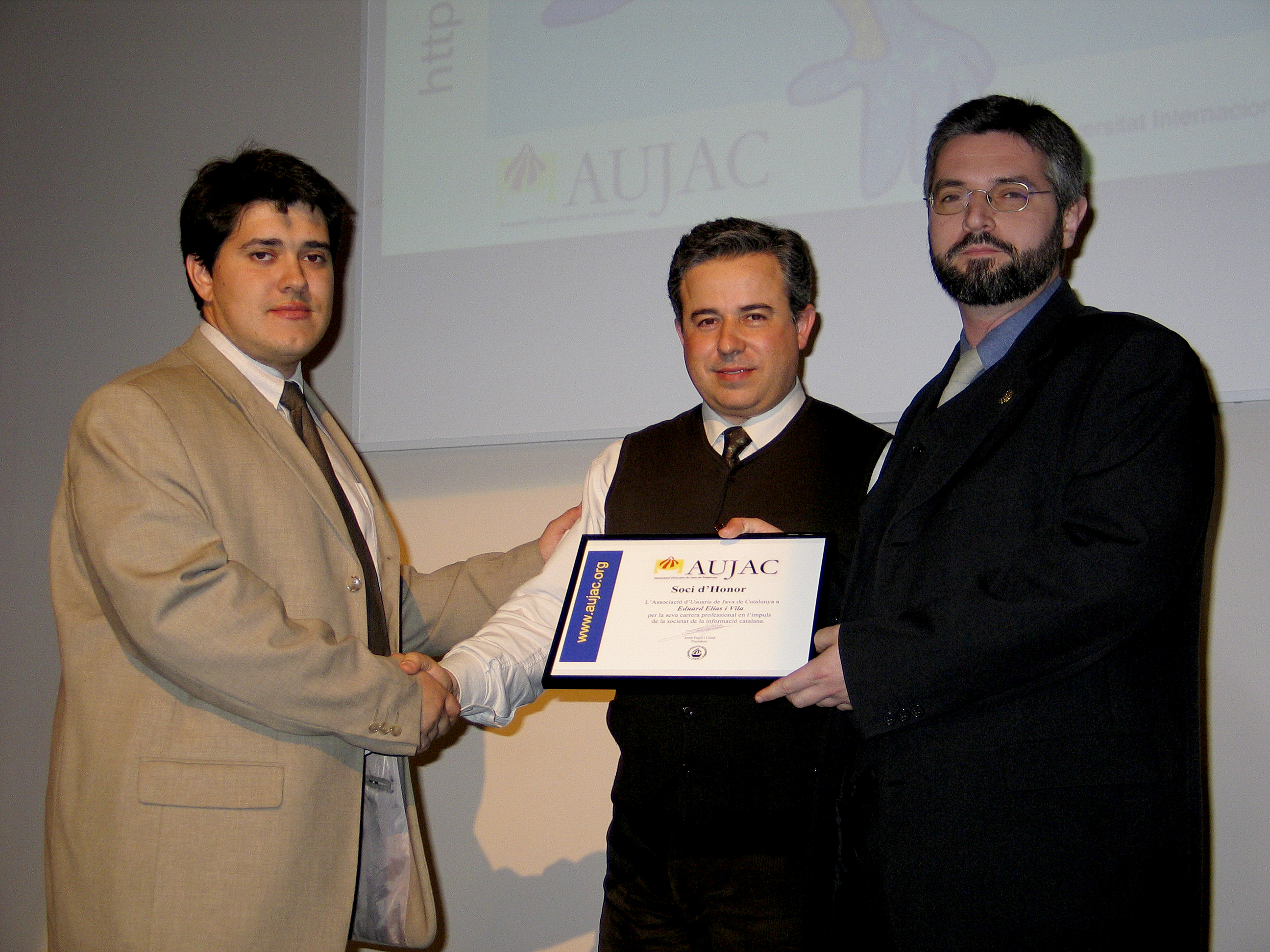 Mr. Eduard Elias (right) receiving the Honorary Member 2004